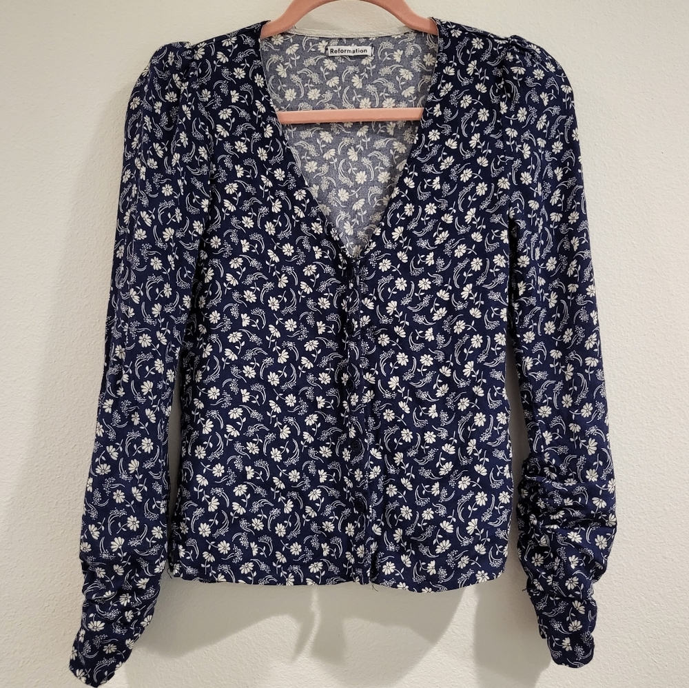 "Reformation floral V-neck blouse in XS, used but in excellent condition."
